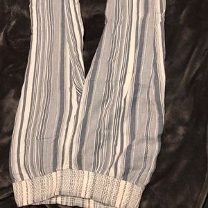 Long striped pants that flare out at the bottom